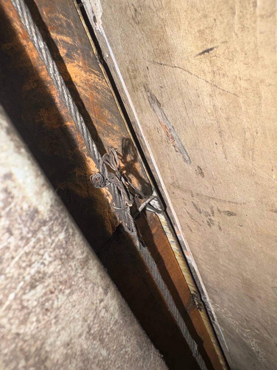 Frayed garage door lift cable on a Doorfect cable replacement service call